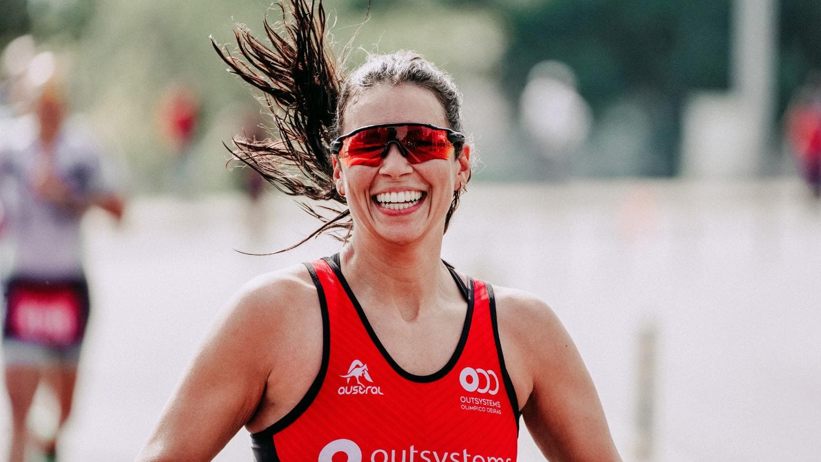 triathlete running outdoors during business trip while maintaining triathlon training plan