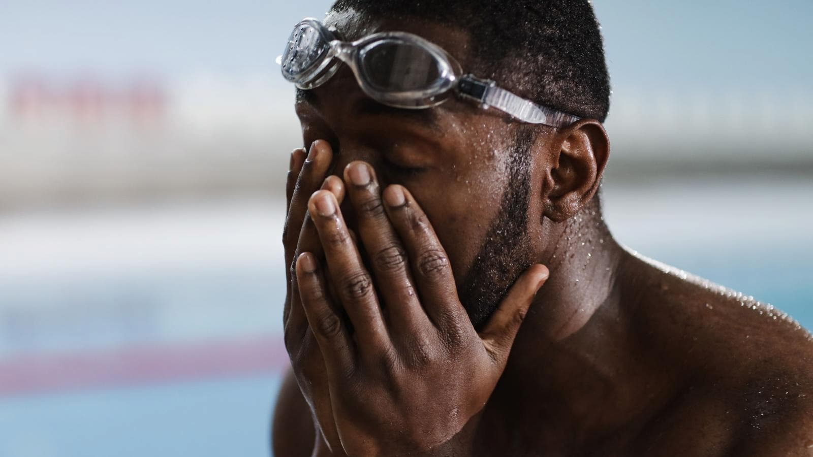 triathlete sitting alone after competition while processing emotions and recovery after race