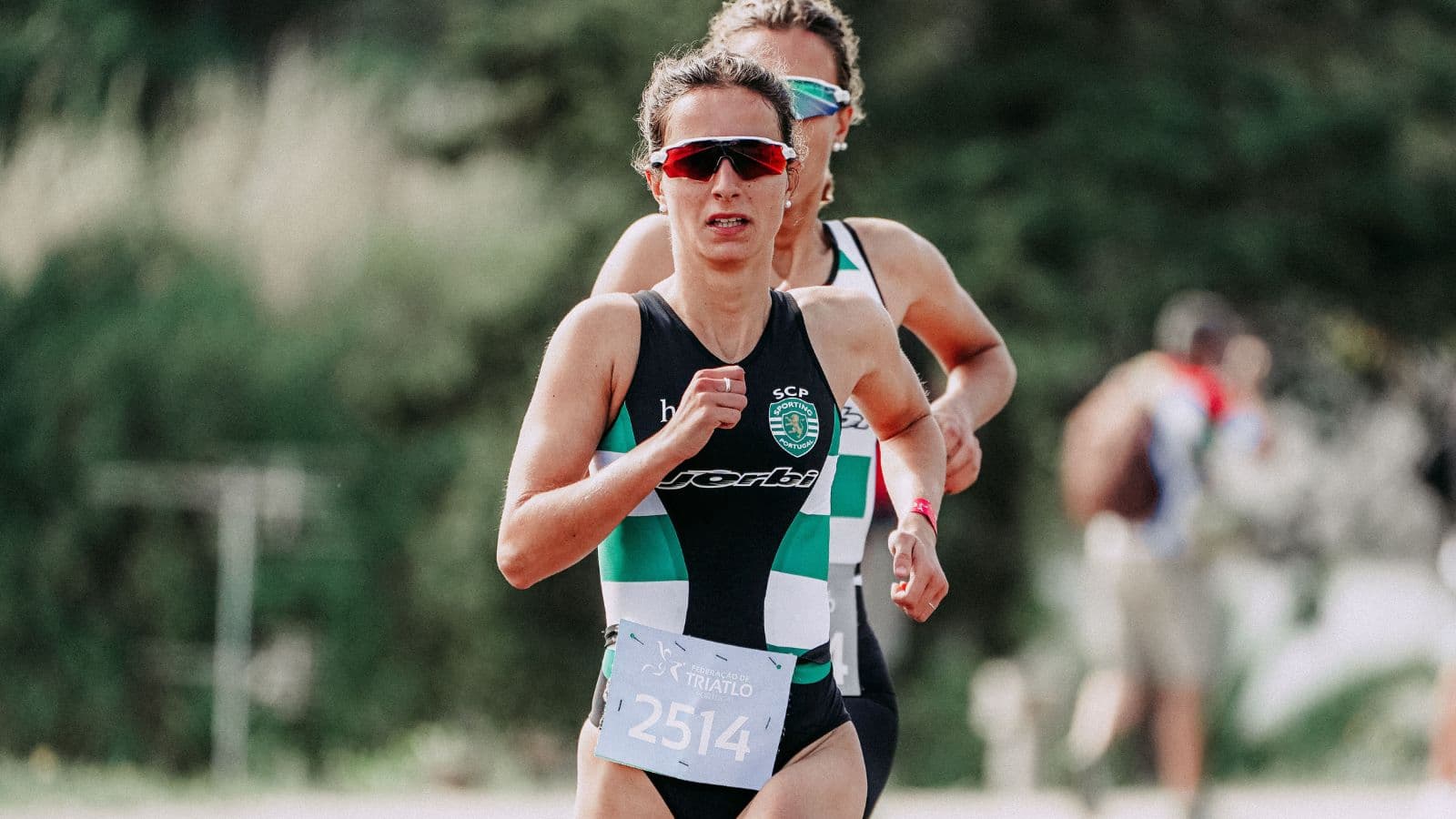 athlete balancing triathlon and ultrarunning training with swim bike run and trail workouts