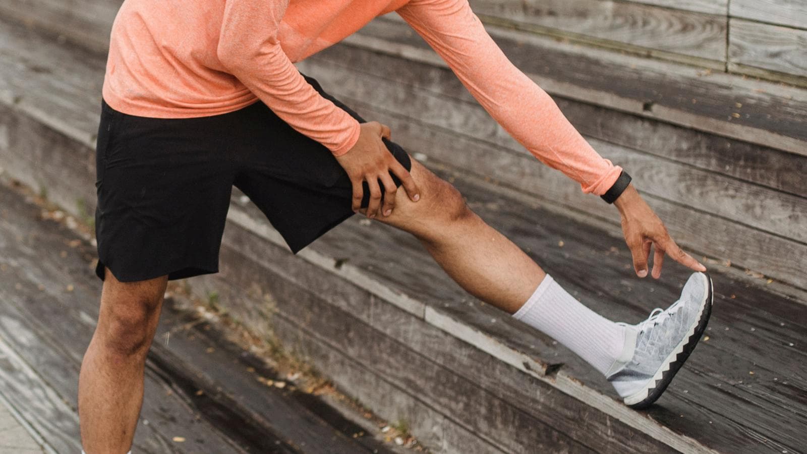 triathlete experiencing shin pain during run training and treating shin splints with recovery techniques