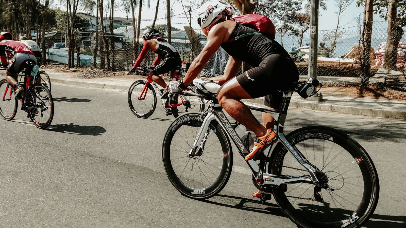 triathlete cycling consistently during training to build endurance and long term performance gains