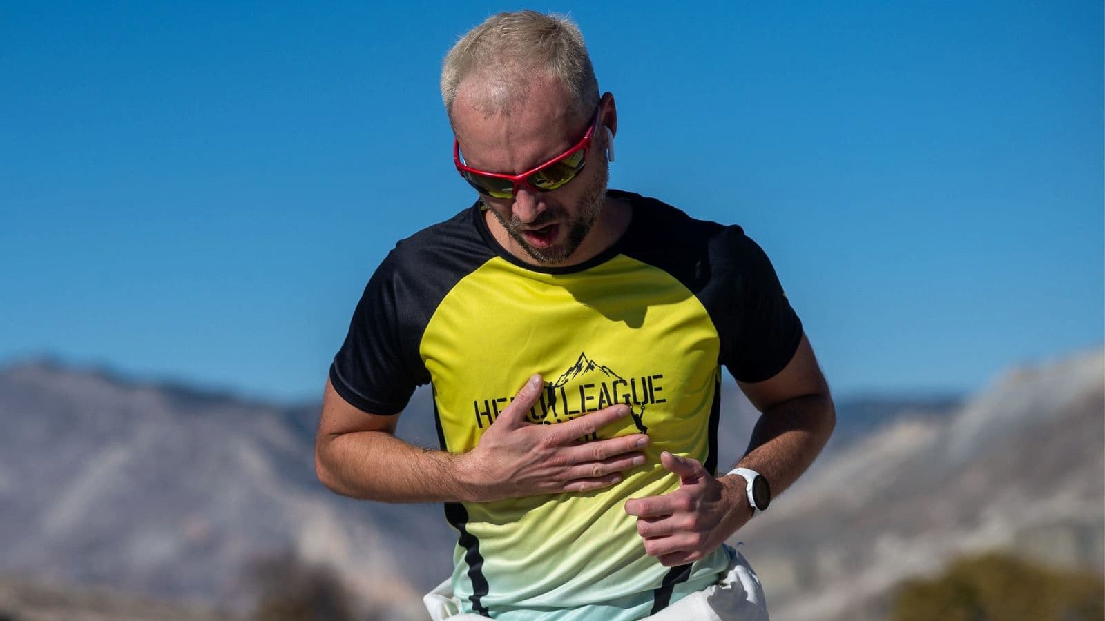 endurance athlete dealing with skin chafing on chest during triathlon run segment