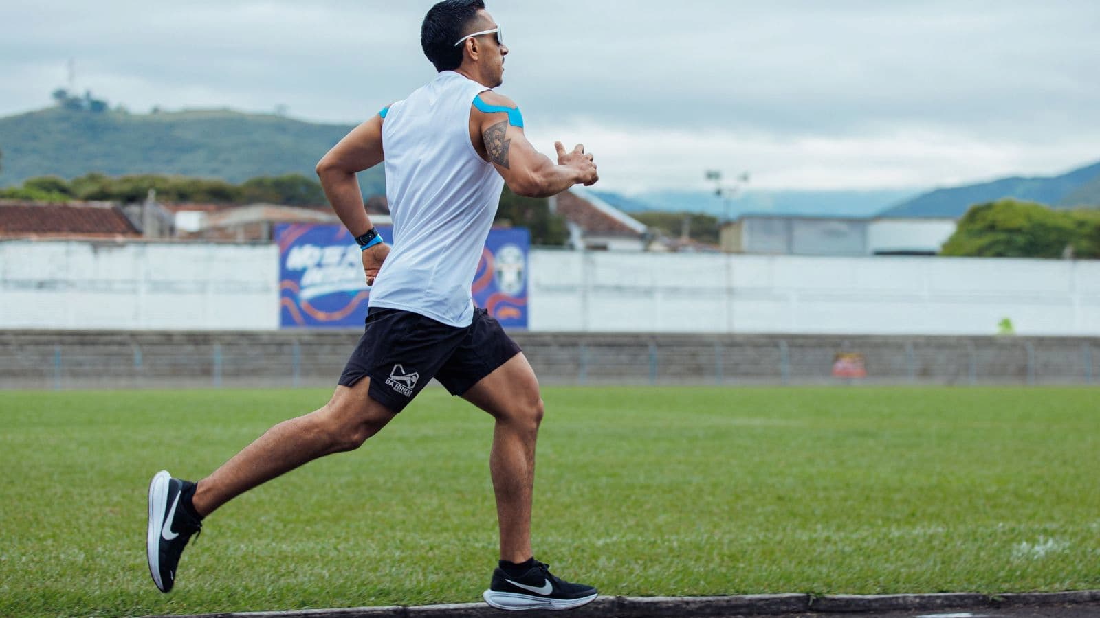 triathlete demonstrating proper running form with powerful hip extension during race training