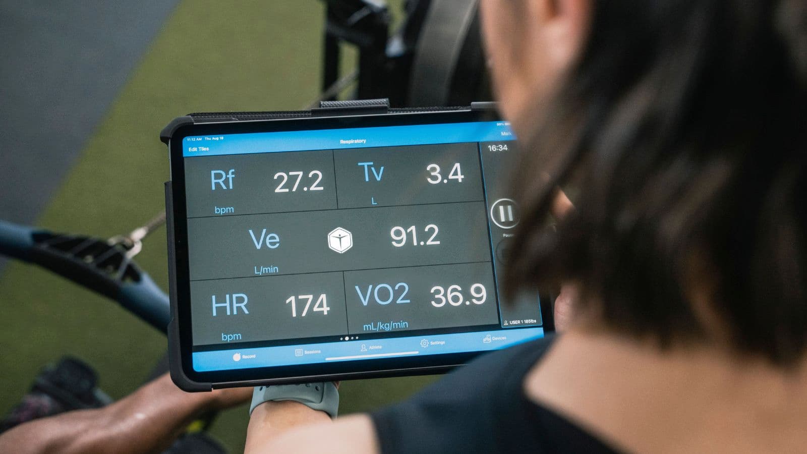 triathlete reviewing performance metrics and training analytics on digital devices