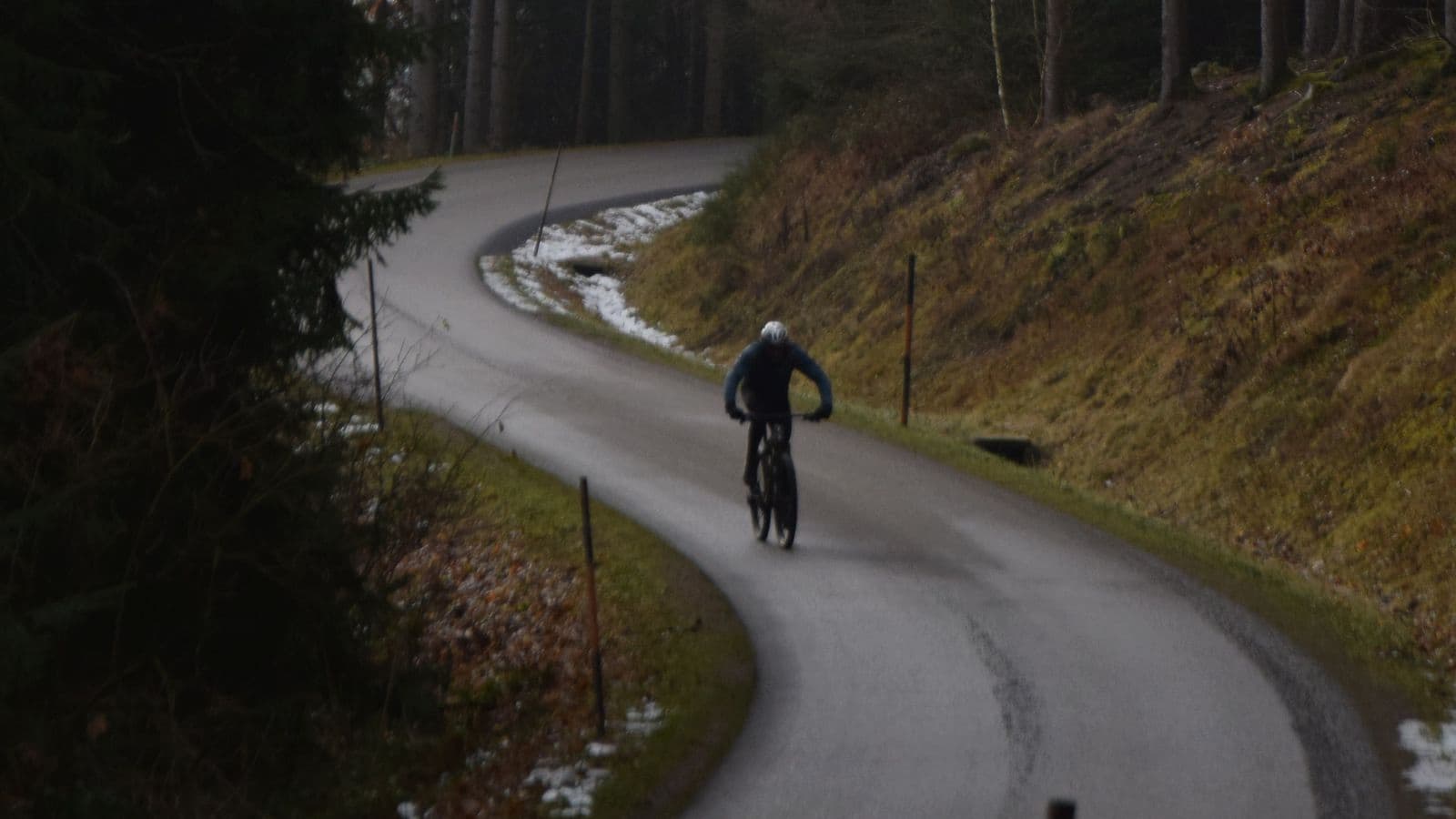 triathlete navigating wet winter roads while improving cycling technique and handling skills