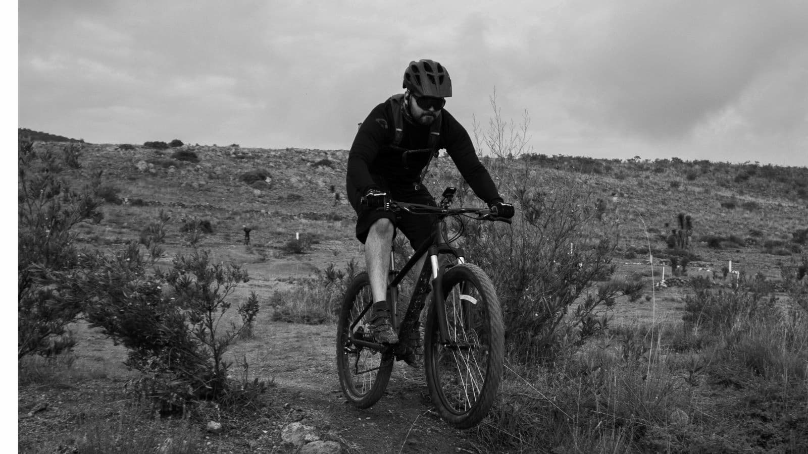triathlete learning mountain bike handling techniques on beginner friendly trail