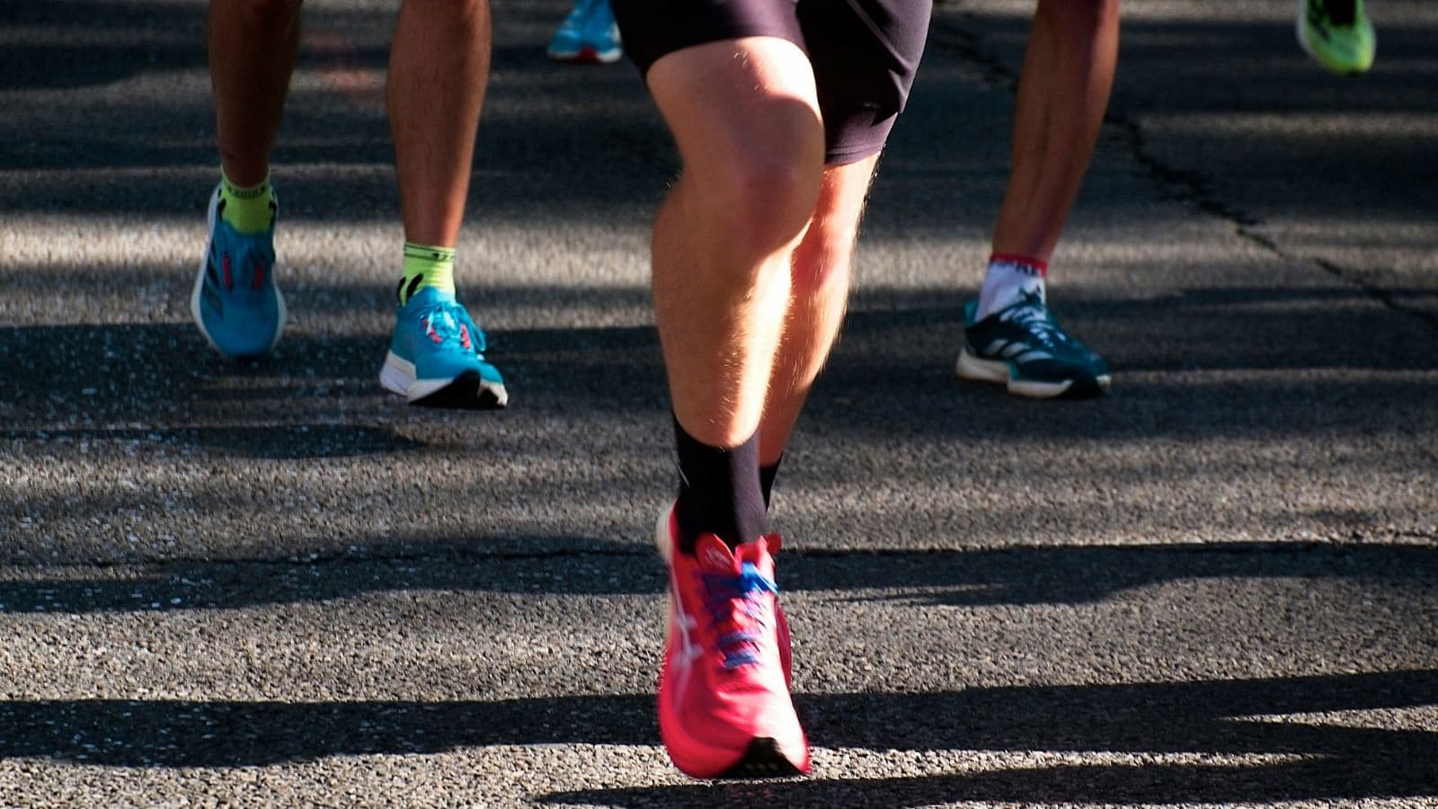 professional triathlete transitioning from bike to run while maintaining speed and strong running form