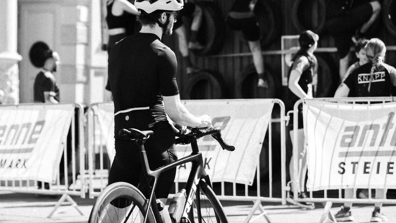 triathlete competing in road bike race to improve cycling speed handling skills and race confidence