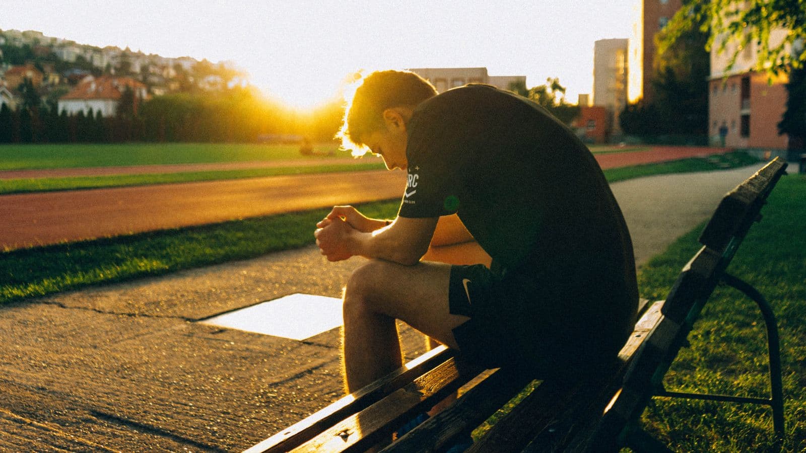 triathlete sitting thoughtfully after training session during off season transition period