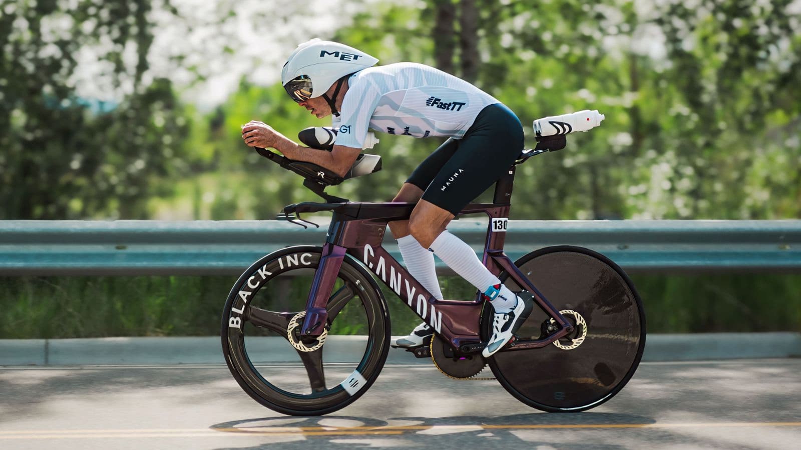 triathlete riding in competitive cycling peloton during road race to build race experience