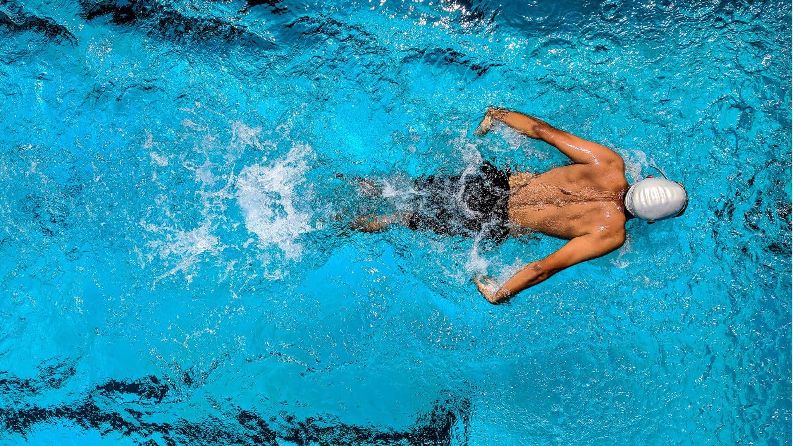 triathlete training in open water to gain experience before upcoming triathlon race