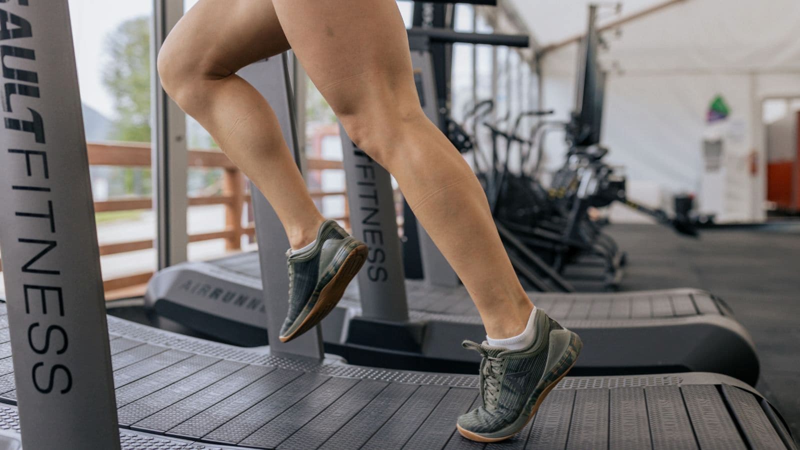 triathlete using treadmill to train for advanced stages of triathlon