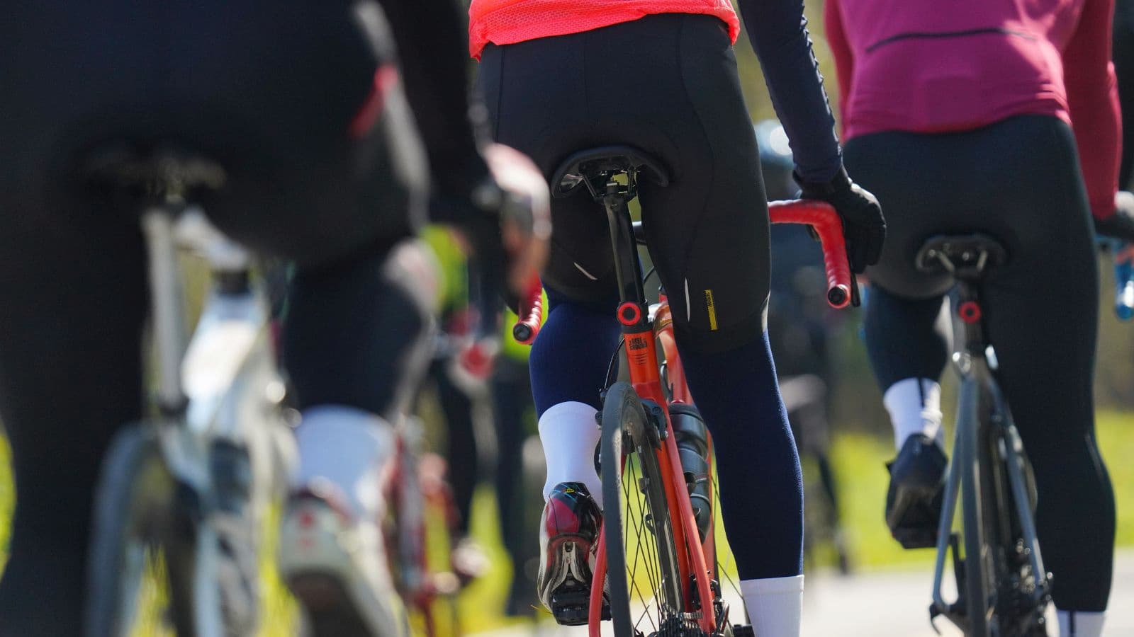 Triathletes cycling with proper fits