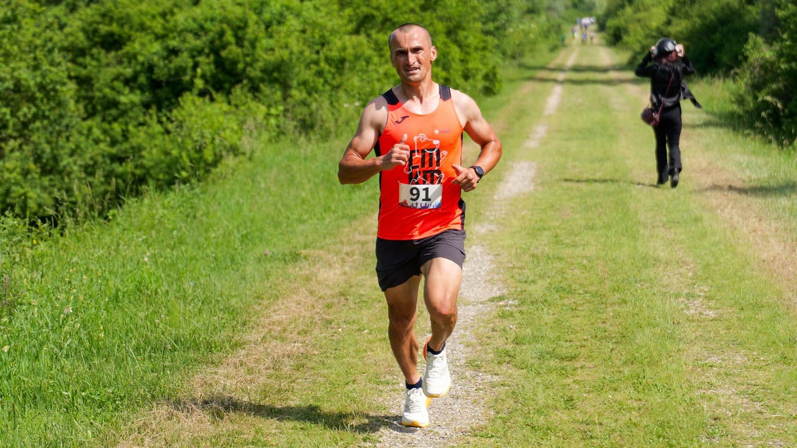 Runner completing a structured interval workout on a running track to rebuild speed after a period of slower training.