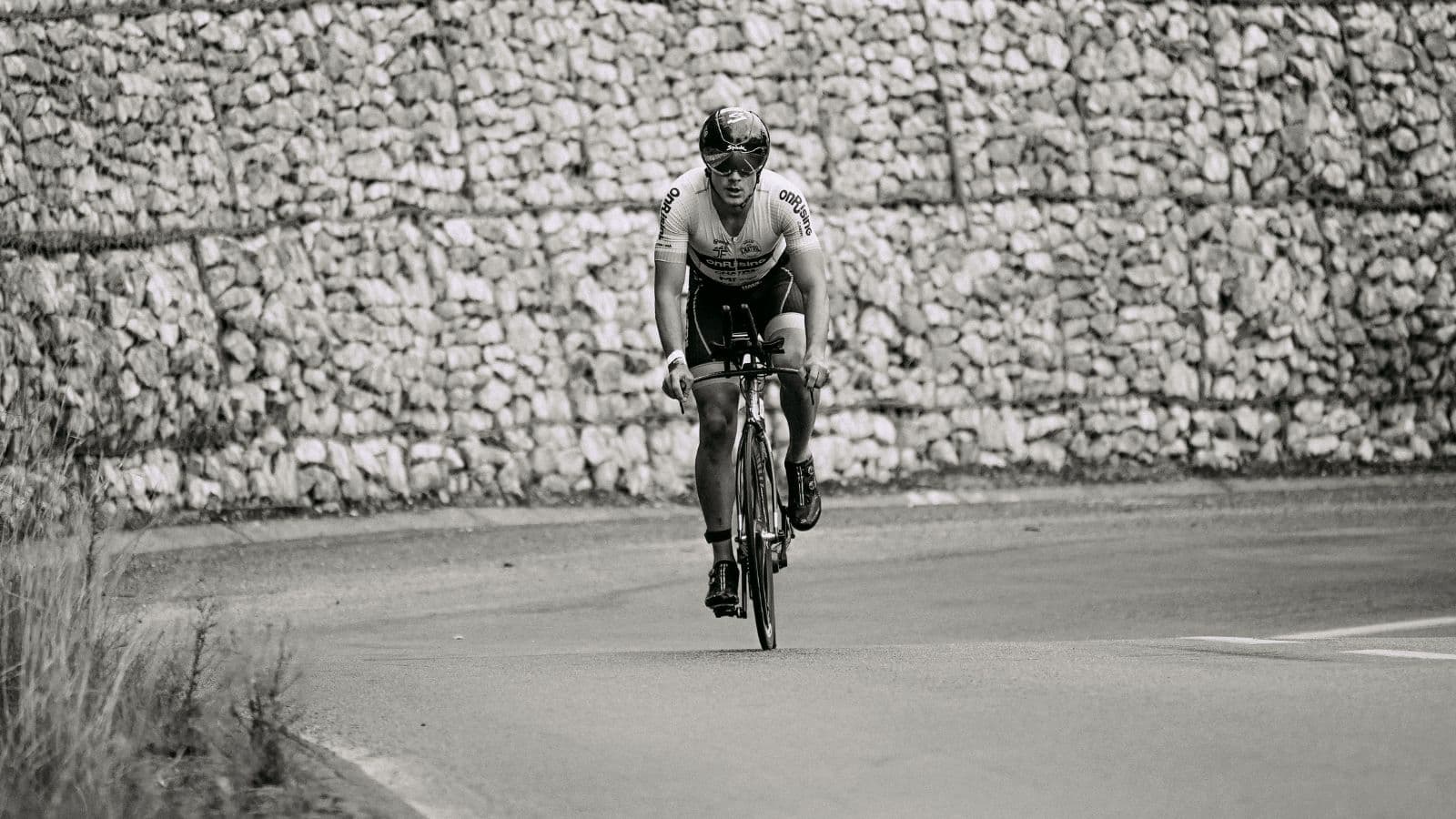 Triathlete riding at lactate threshold intensity during a structured cycling workout to improve endurance and sustainable power.