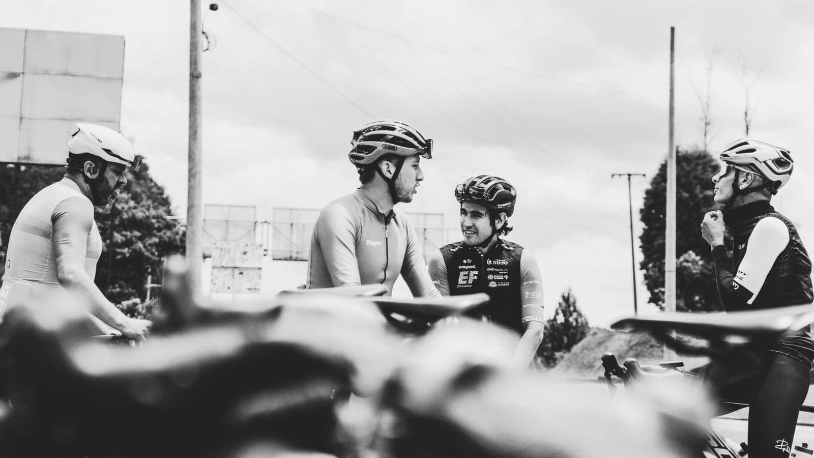 Triathlete monitoring cadence on a cycling computer while maintaining a smooth pedal stroke during a structured training ride.