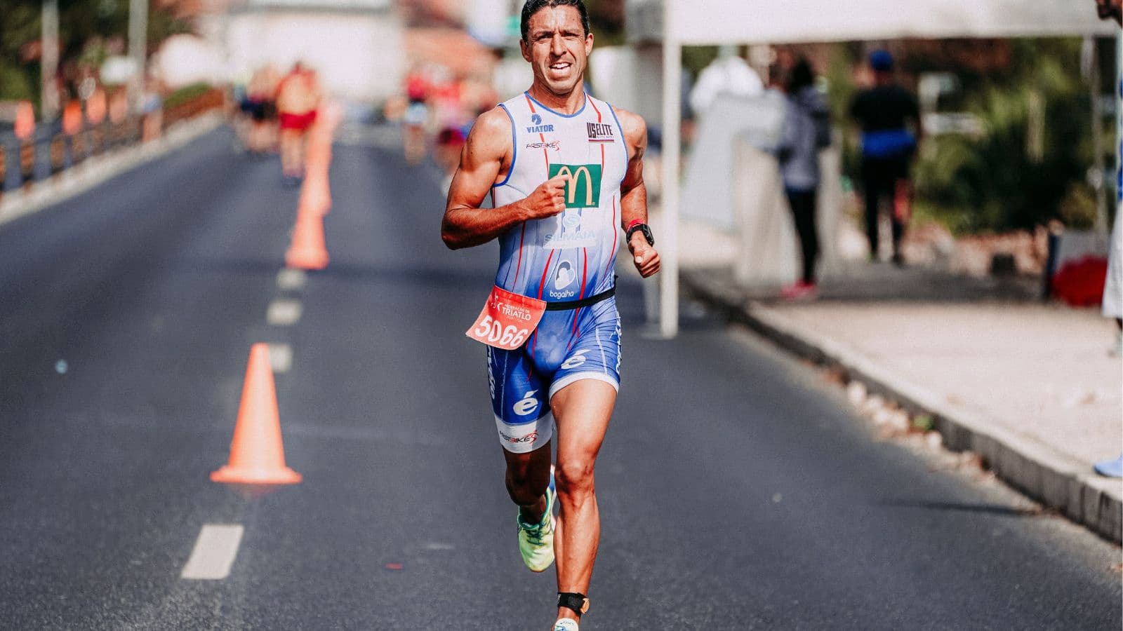 Competitive triathlete performing tempo run training to boost running pace and cardiovascular endurance before race day.