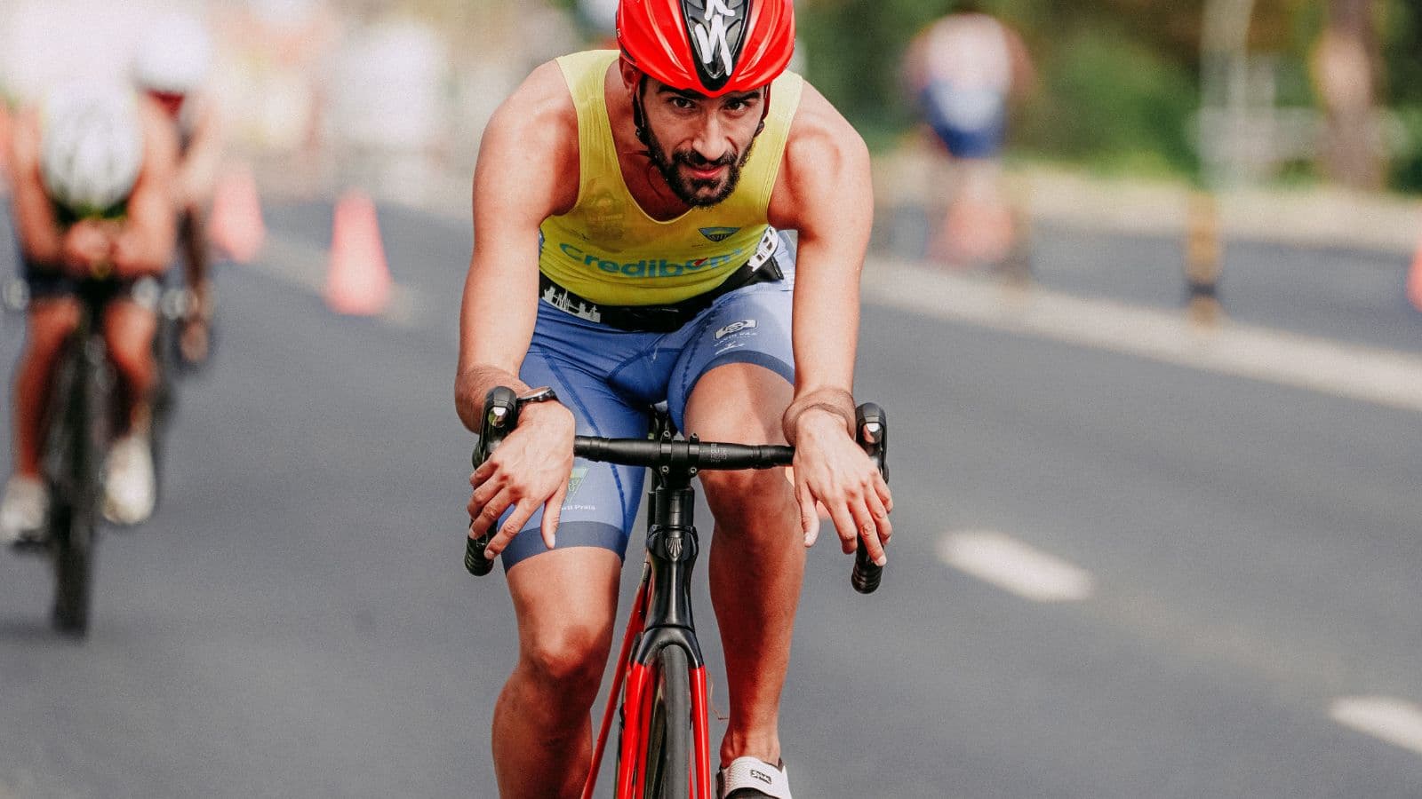 Cyclist pushing hard during a high-intensity interval effort on an outdoor training ride