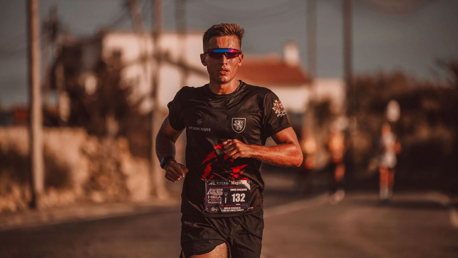 Triathlete running at an easy pace during an endurance workout to safely increase weekly running volume without injury.