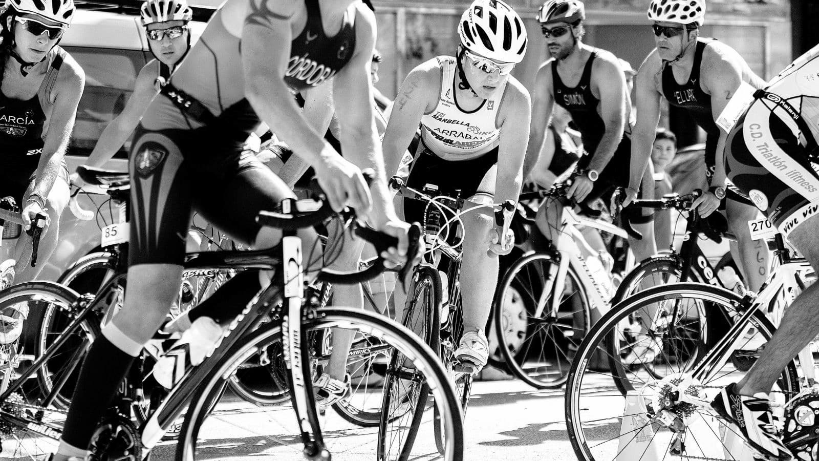 triathletes riding together in organized group ride to build cycling fitness and road confidence