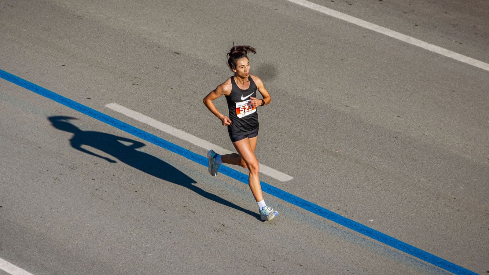 Triathlete performing single-leg strength and mobility exercises to support injury-free running and increase training volume.