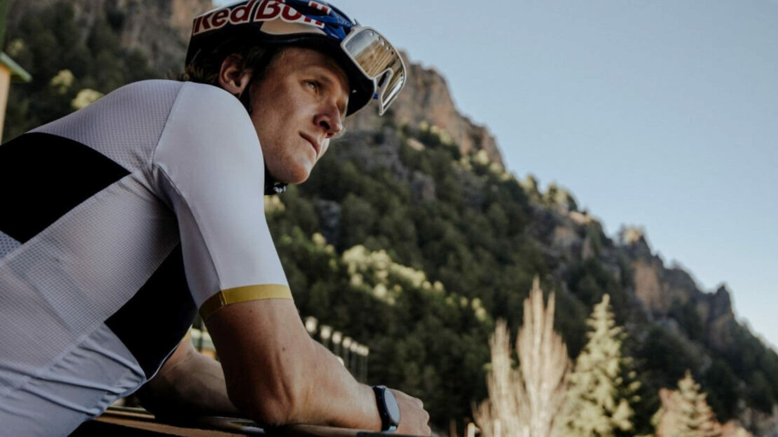 road cyclist deciding between indoor bike trainer and outdoor cycling route for daily workout