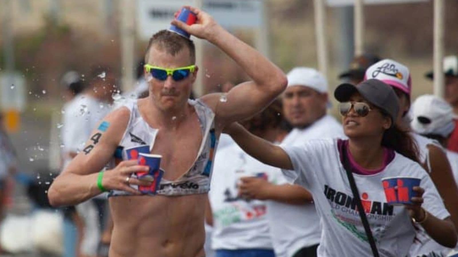 triathlete carrying energy gels and hydration during long training run for triathlon