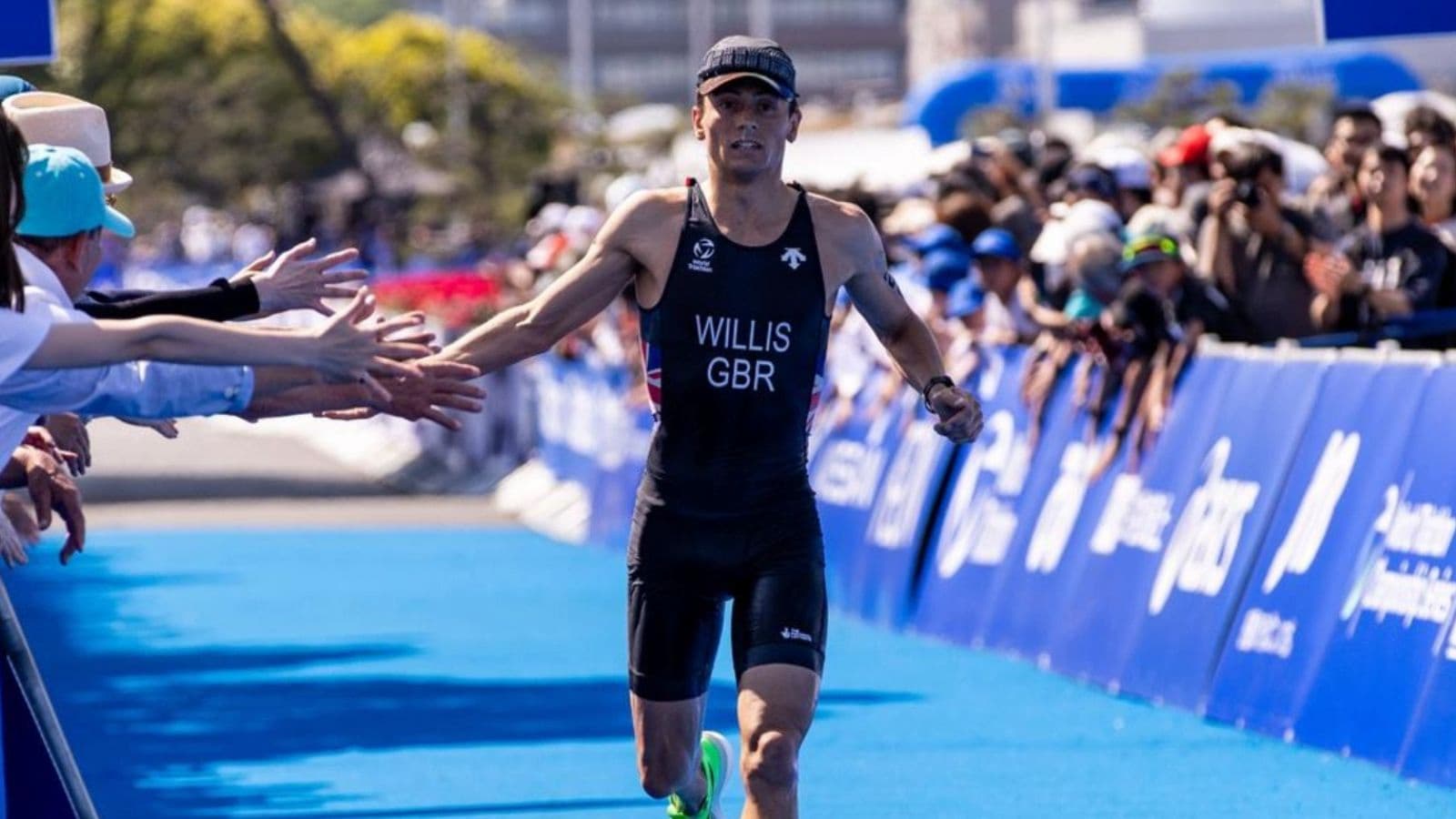 Triathlete maintaining a controlled running pace after cycling to manage fatigue during the run leg of a triathlon.