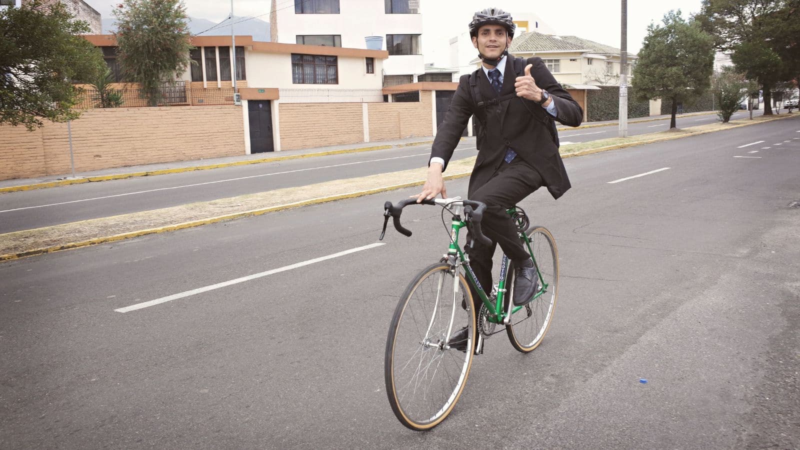 Triathlete completing controlled cycling intervals on a safe section of road during a bike commute.