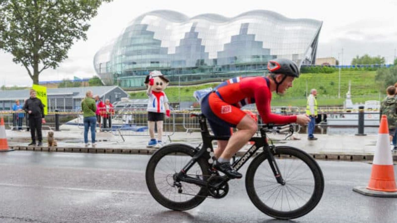 Triathlete completing structured cycling intervals with progressively shorter efforts during a descending interval bike workout.