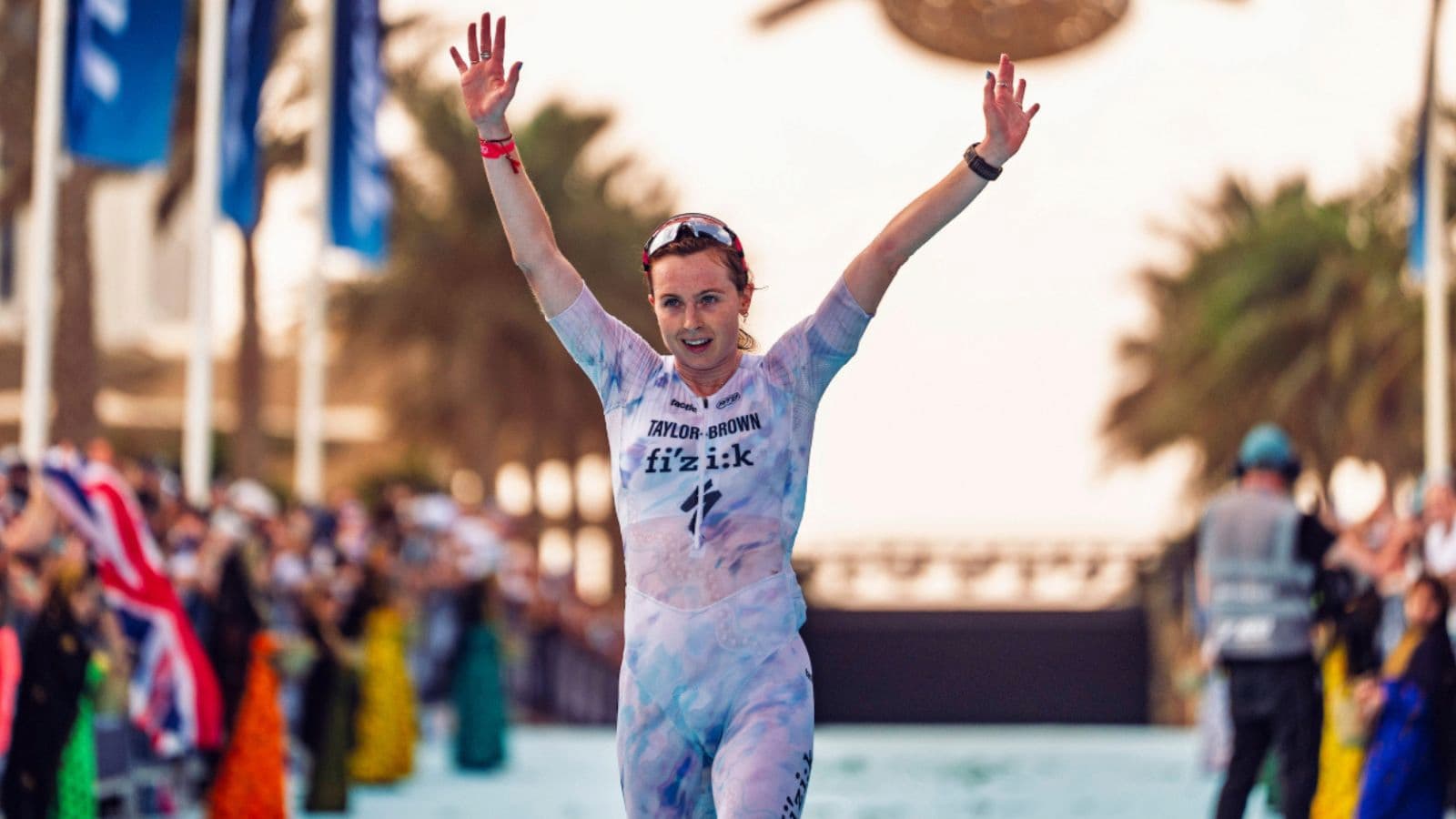 Female Triathlete completely exhausted during the race looking for hydration