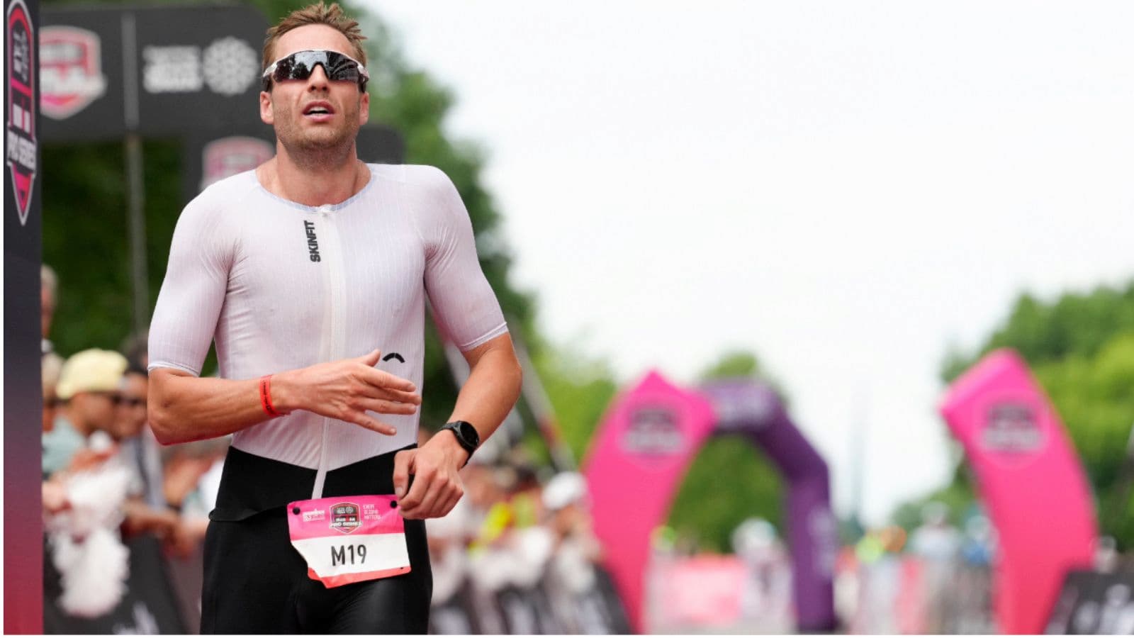 Triathlete stopping during the run leg of a race after experiencing concerning physical symptoms instead of continuing to push.