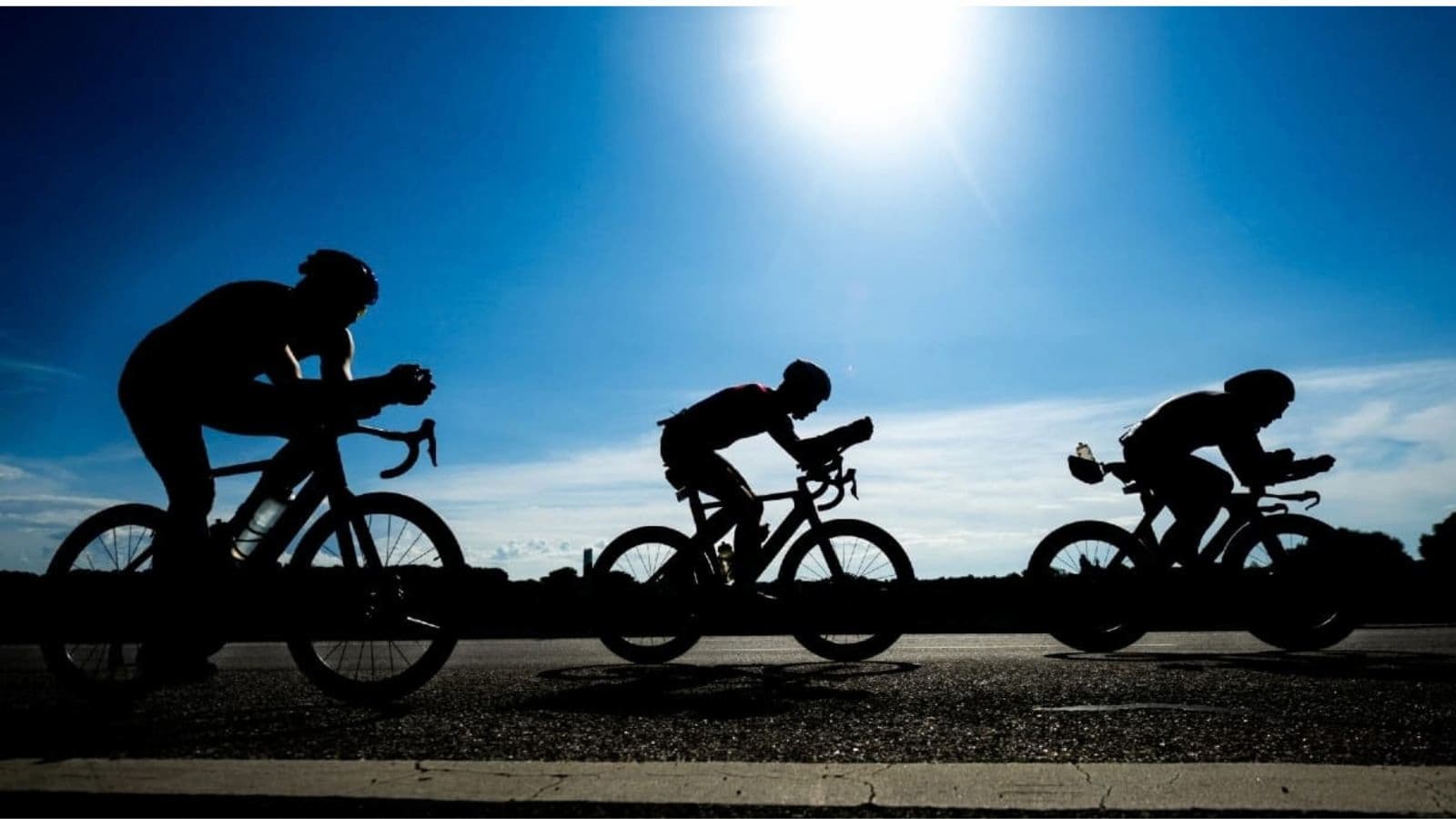 Triathlete maintaining a smooth and controlled cycling cadence while riding in an aerodynamic position during training.