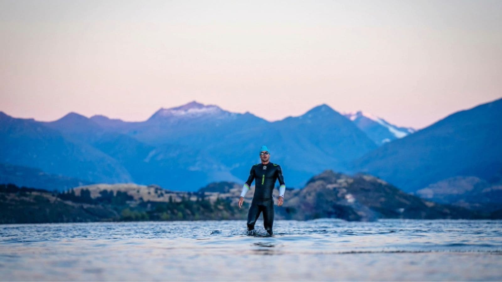 Triathlete performing a swim drill designed to improve body position, balance, and alignment in the water.