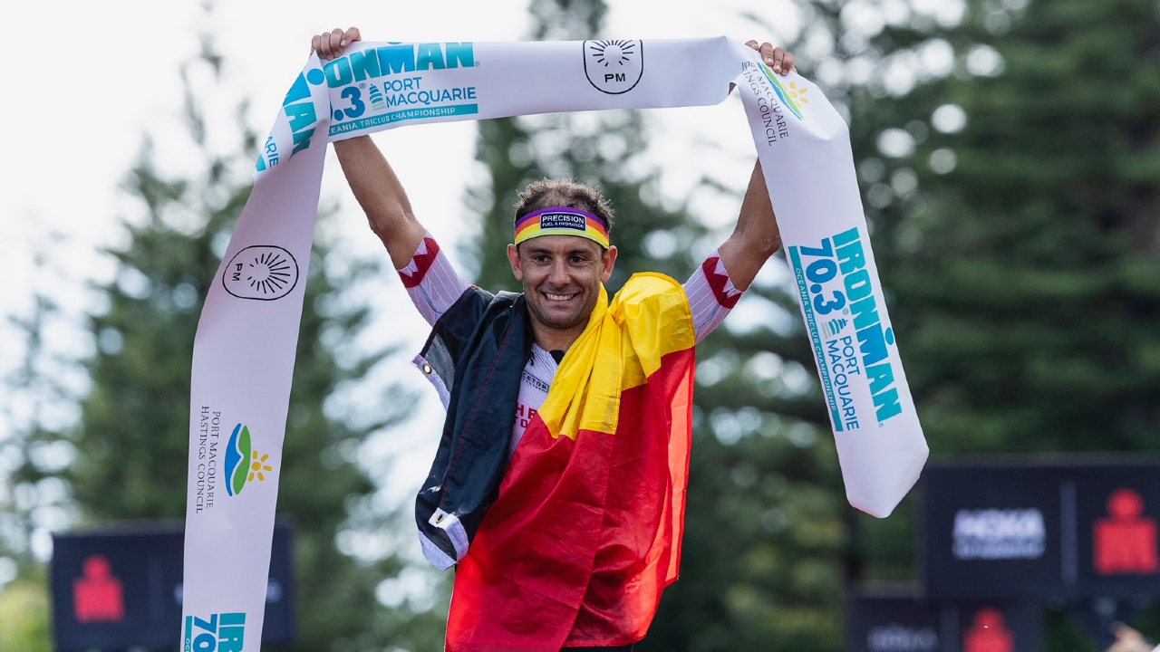 Jelle Geens belgian flag taking the win at IRONMAN 70.3 Port Macquarie - Photo Korupt Vision