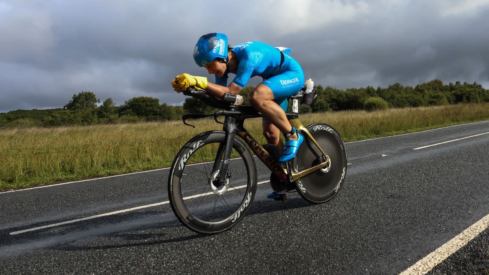 First-time triathlete riding a standard road bike during the cycling leg of a beginner-friendly sprint triathlon.
