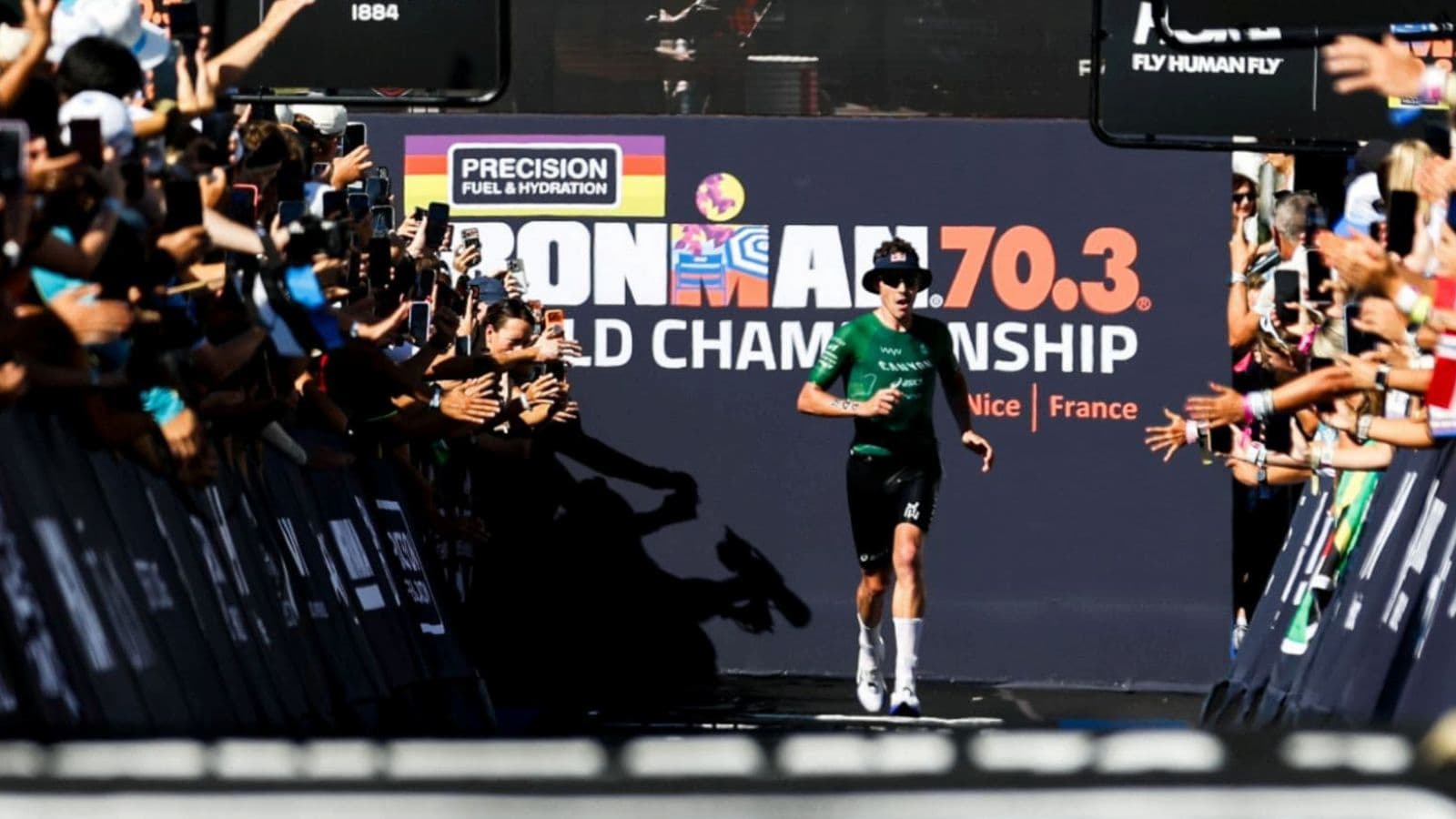 Triathlete completing a longer endurance training session while progressing from short course racing toward a 70.3 triathlon.